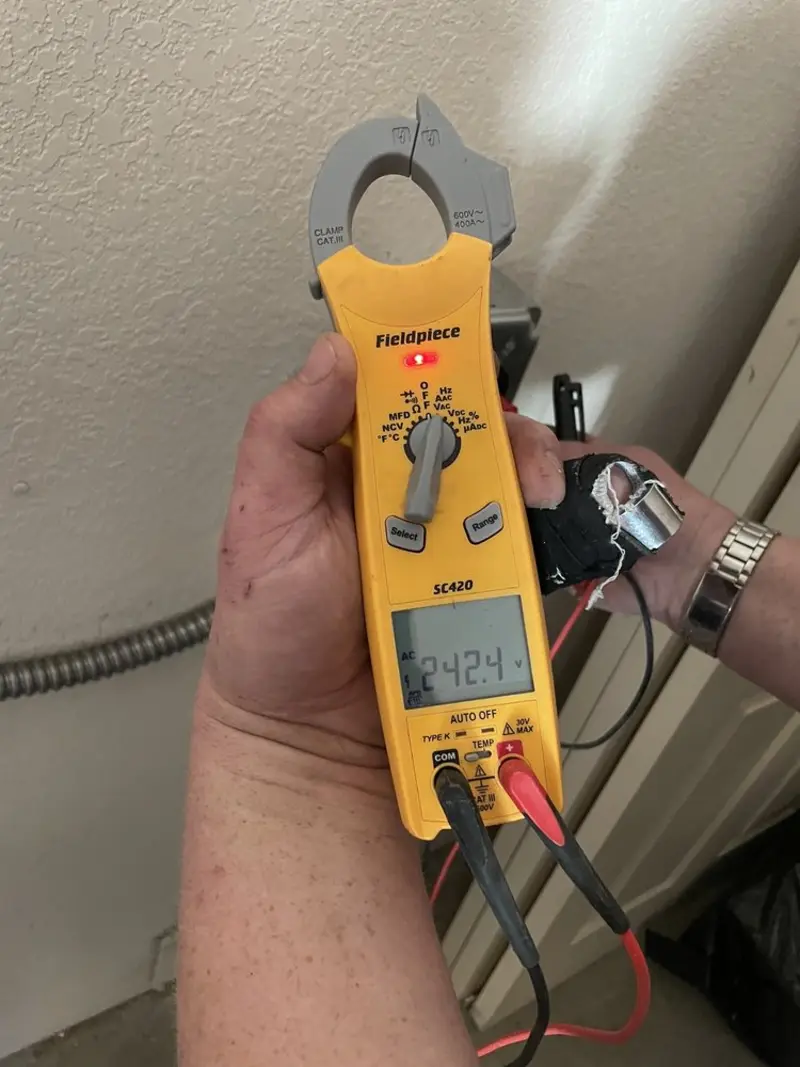 Voltage testing with clamp meter during Aluminum Wiring Replacement in Bayou Blue